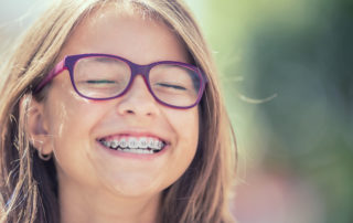 kid with braces smiling